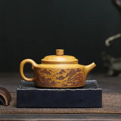 Théière Zisha argile violette gravée paysages chinois