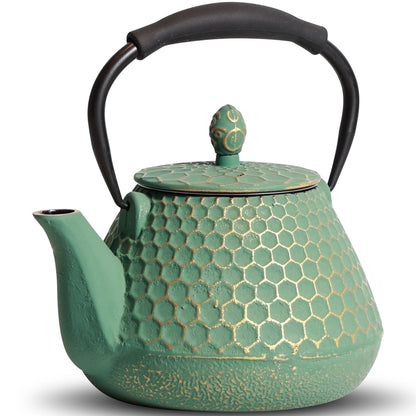 Théière en fonte dorée design nid d'abeilles détail