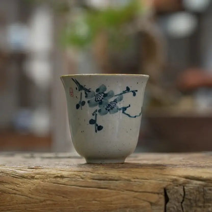 Tasse à thé en céramique au motif bleu de fleur de prunier