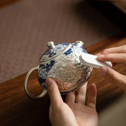 Théière porcelaine argentée avec son coffret élégant