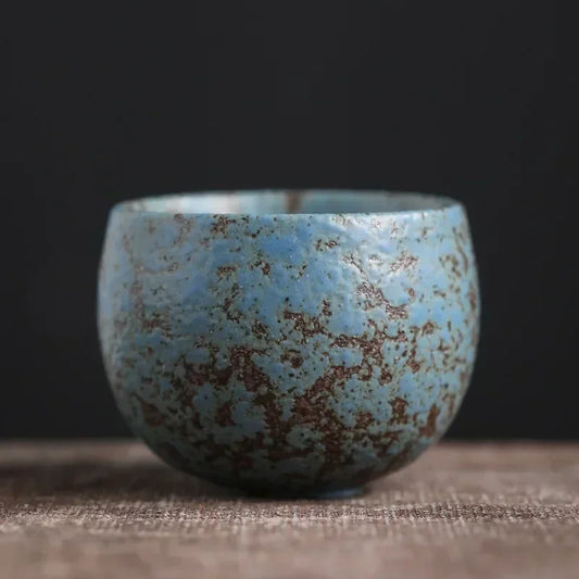 Tasse à thé en grès émaillé bleu turquoise moucheté de rouille