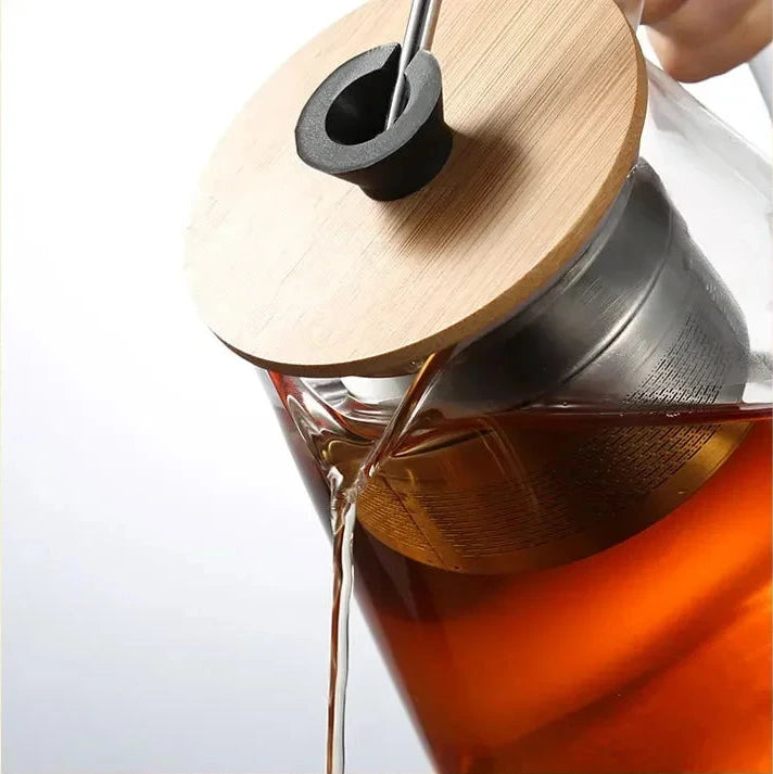 Détail couvercle et bouton en bois théière en verre