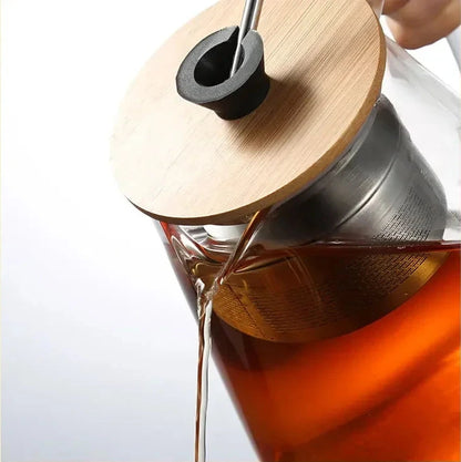 Détail couvercle et bouton en bois théière en verre