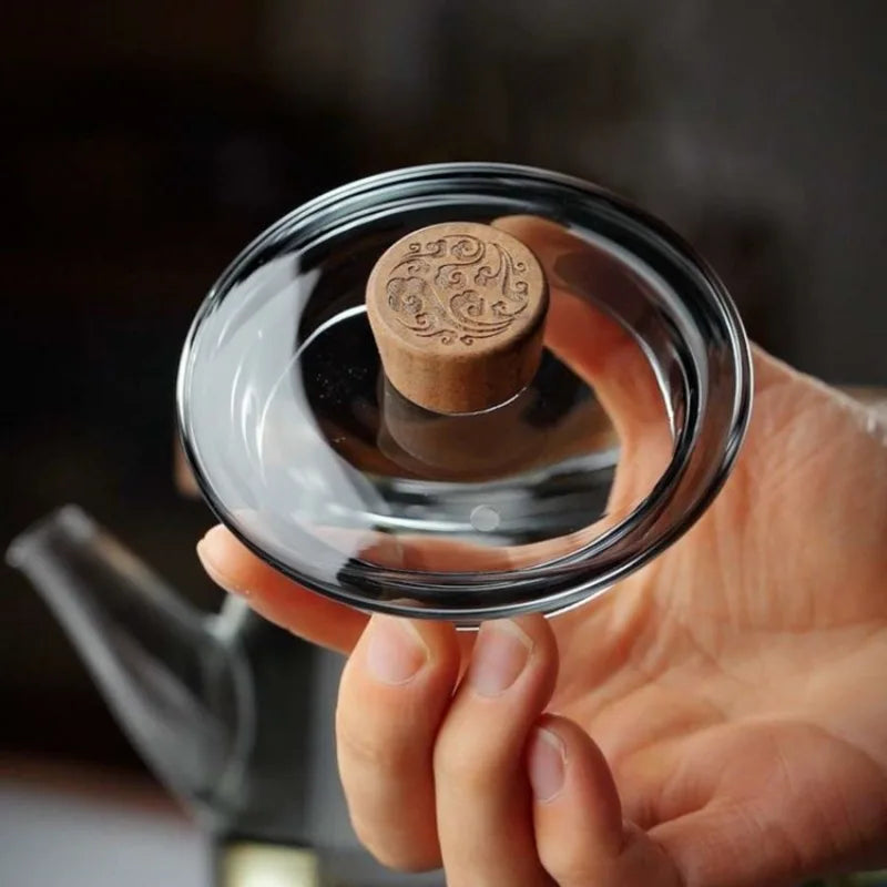 Théière en verre avec filtre intégré et motifs décoratifs